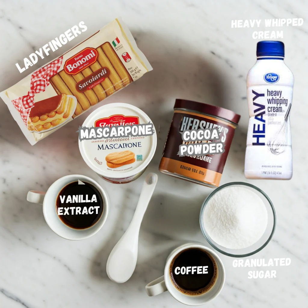 The ingredients needed for tiramisu including ladyfingers, espresso, mascarpone, cocoa powder, cream, vanilla and sugar.