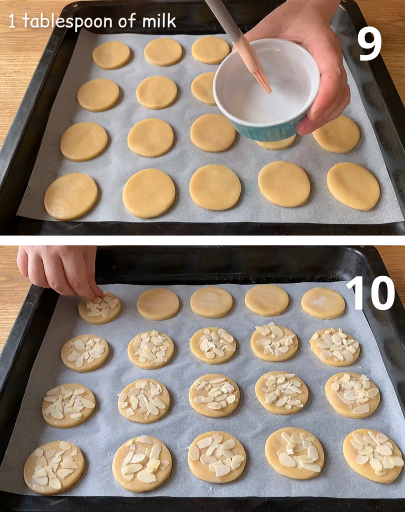 cookies brushed with milk and sprinkled with sliced almonds, ready for baking.